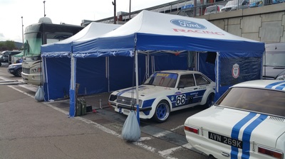 Two 3x6m motorsport gazebos in blue and white with Ford logos and Ford RS2000 cars