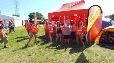 Tangerine Fields pop up gazebo in orange with event staff at Isle of Wight Festival